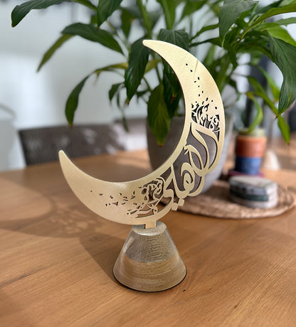 Custom-made home décor for Ramadan by Kashida design, in the shape of a Ramadan Hilal with Arabic calligraphy names