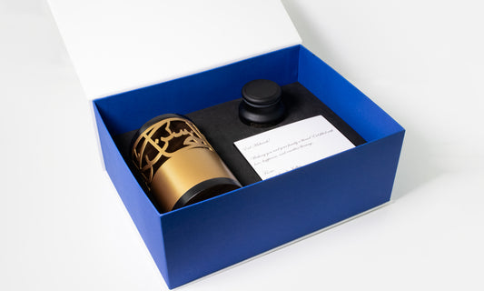 Luxury gift set containing personalised Arabic calligraphy incense burner with bakhur in premium branded gift box.