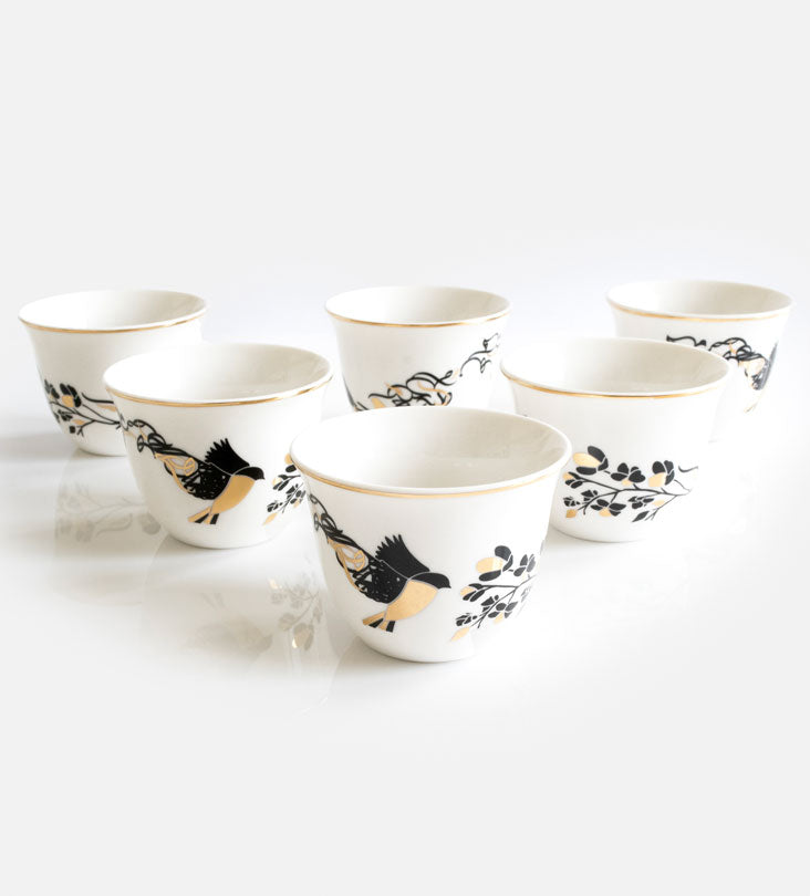 Kashida's Freedom Arabic coffee cups embody the tale of a bird in flight sharing her story of freedom with another bird. Rotate the cup to view Arabic letters disintegrate from the wings of the creature, signifying the spreading of her message to the world. The design is dynamic, featuring high contrasting colors which truly captivate the eye.