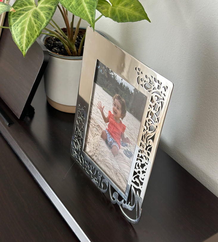 Mirror polished shiny steel photo frame featuring Arabic calligraphy by Kashida design