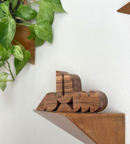 Contemporary decorative accents made with solid acacia wood, carved with modern Arabic calligraphy words.