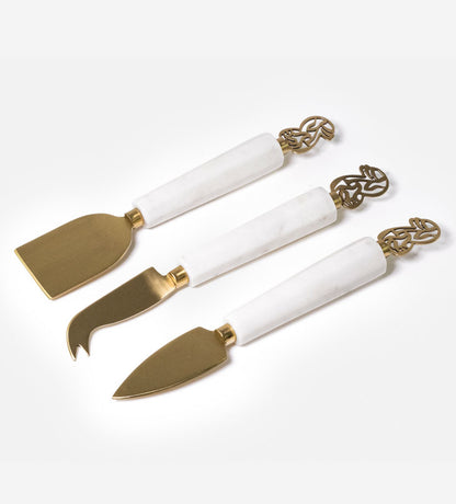 Elegant cheese knives set made with marble and brass featuring Arabic calligraphy designs.