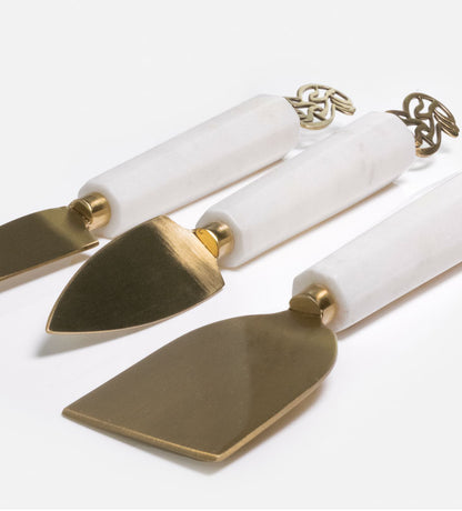 Elegant cheese knives set made with marble and brass featuring Arabic calligraphy designs.