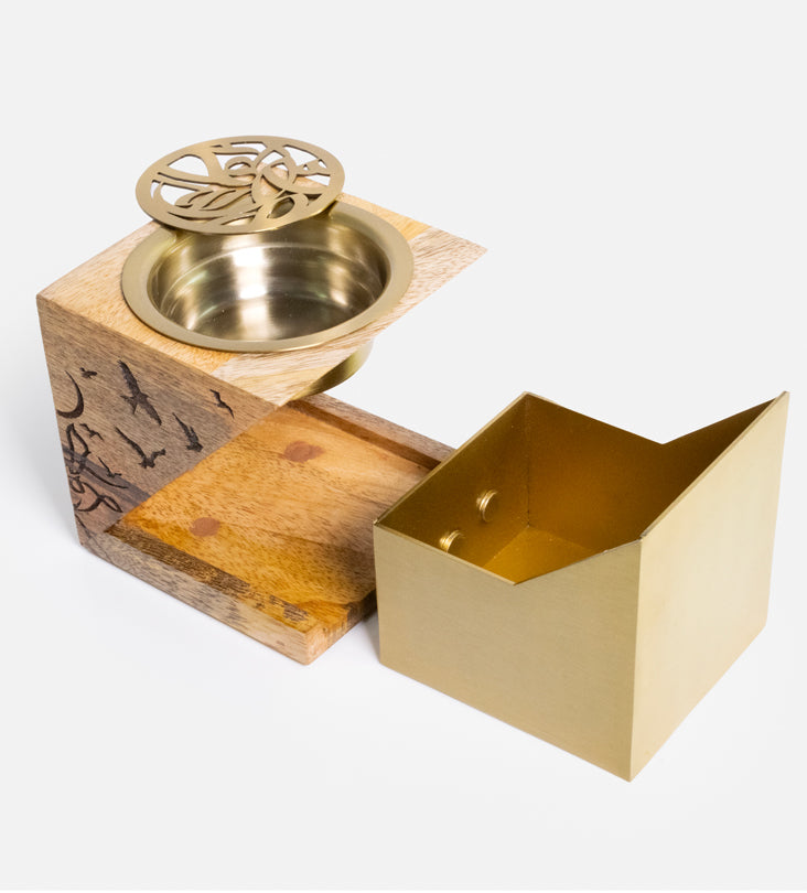 Cube-shaped incense burner made with wood and brass featuring Arabic calligraphy etchings, designed by Kashida.