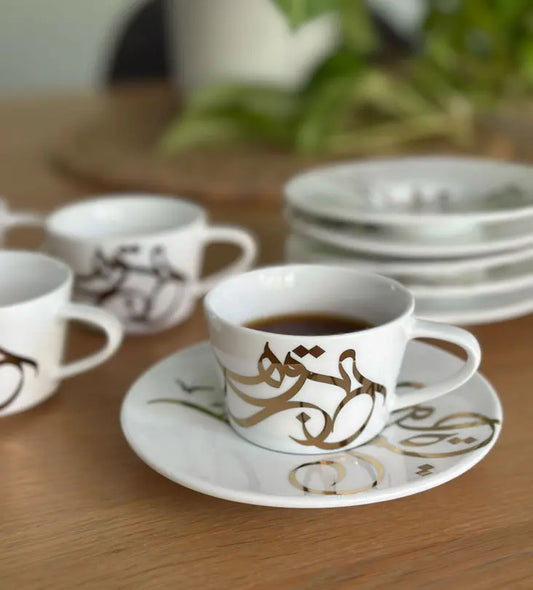 Contemporary gold and silver porcelain espresso cups with Arabic graffiti print