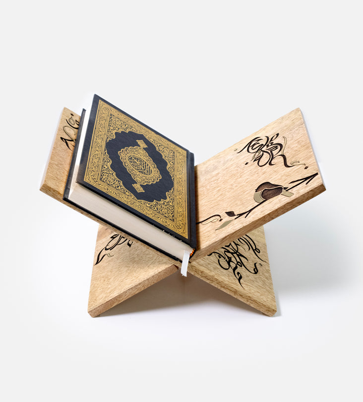 Handmade wooden quran holder featuring artwork of birds merged with Arabic calligraphy made with brass inlay