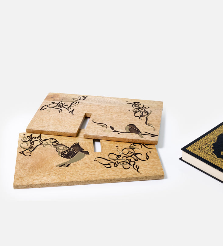 Handmade wooden quran holder featuring artwork of birds merged with Arabic calligraphy made with brass inlay