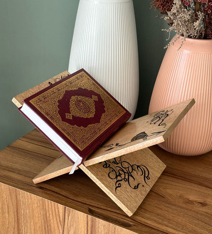 Handmade wooden quran holder featuring artwork of birds merged with Arabic calligraphy made with brass inlay