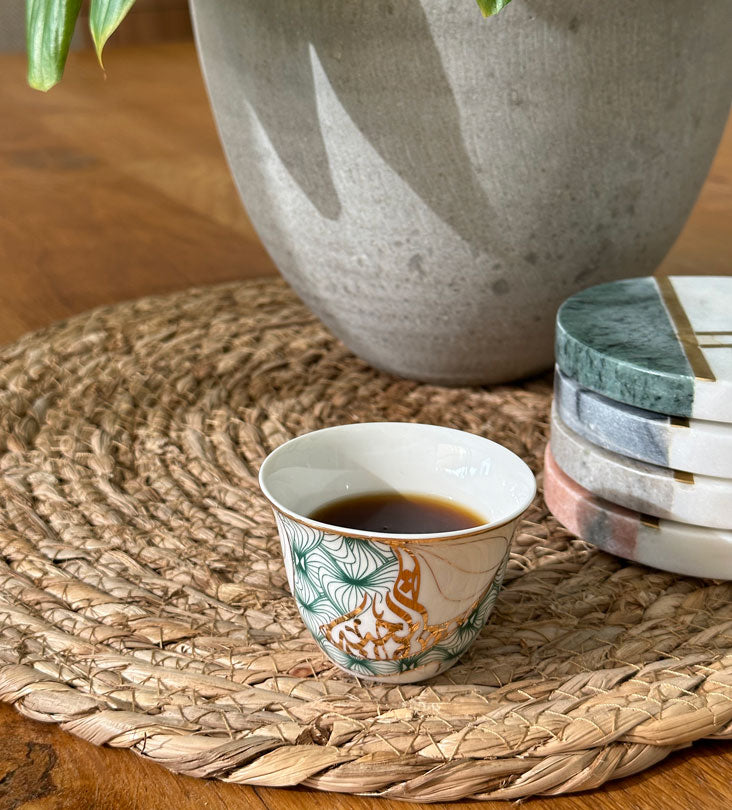 Porcelain Arabic coffee cup by Kashida in emerald green and gold hues