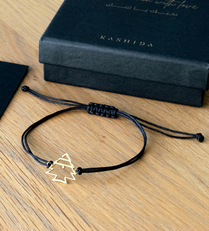 Modern gold bracelet featuring Lebanon's cedar tree designed by Kashida