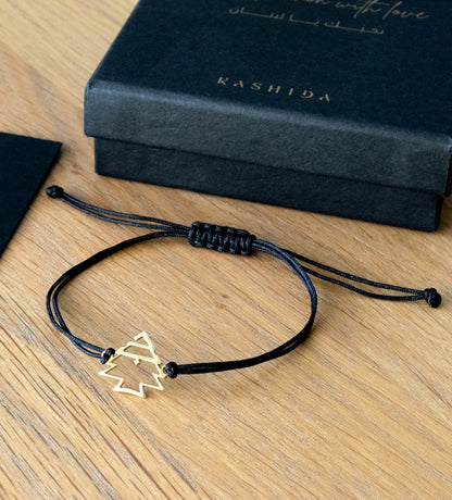 Modern gold bracelet featuring Lebanon's cedar tree designed by Kashida