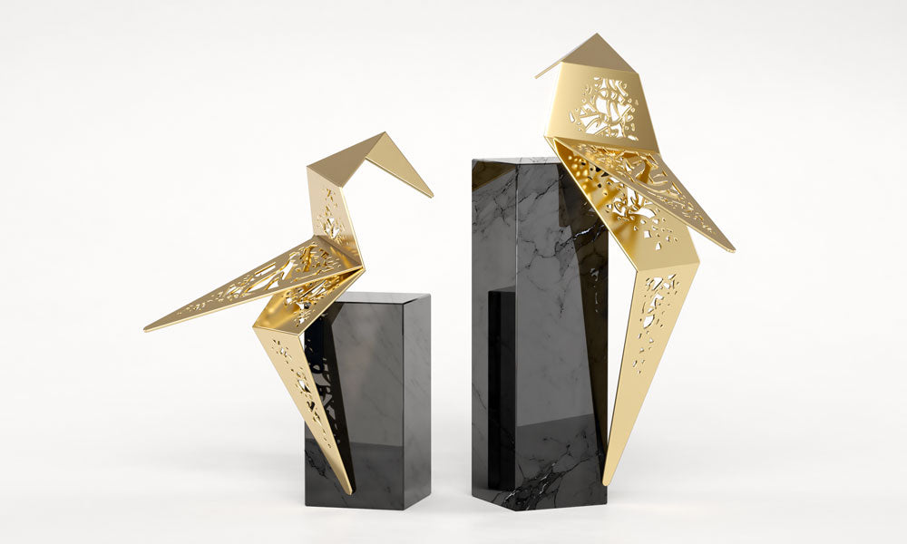 Set of two luxury falcon bird sculptures featuring Arabic calligraphy designed by Kashida