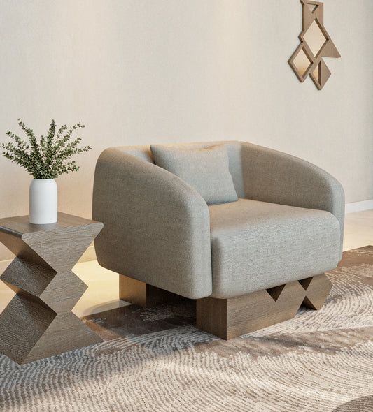 Modern armchair with walnut wood and simple neutral tone upholstery from Kashida's Nuqat collection.
