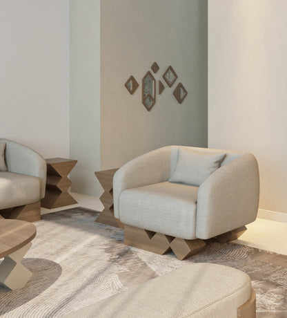 Modern armchair with walnut wood and simple neutral tone upholstery from Kashida's Nuqat collection.