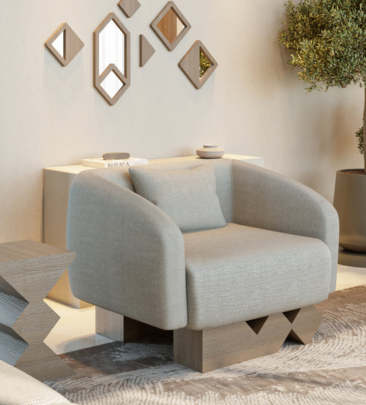 Modern armchair with walnut wood and simple neutral tone upholstery from Kashida's Nuqat collection.