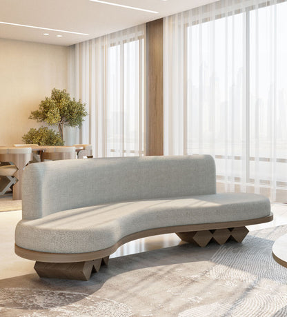 Modern fluid sofa with organic shape and simple neutral tone upholstery from Kashida's Nuqat collection.