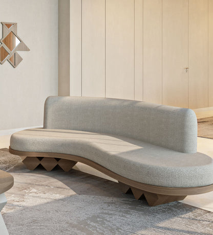 Modern fluid sofa with organic shape and simple neutral tone upholstery from Kashida's Nuqat collection.