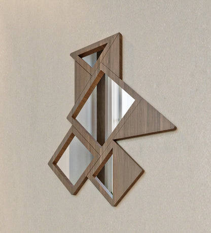 Origami-inspired vertical wooden mirror designed with diamond shaped dots in Arabic calligraphy by Kashida