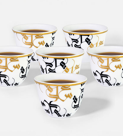 Traditional Arabic coffee cup finjal in royal blue and gold Arabic calligraphy pattern