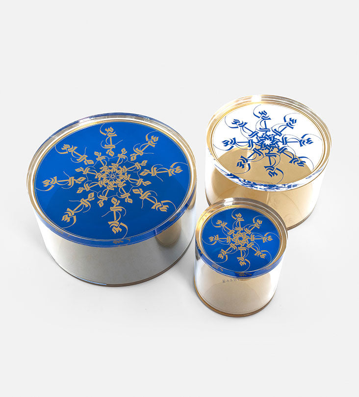 Small Acrylic cylinder container in royal blue and gold with Arabic calligraphy pattern for storing sweets