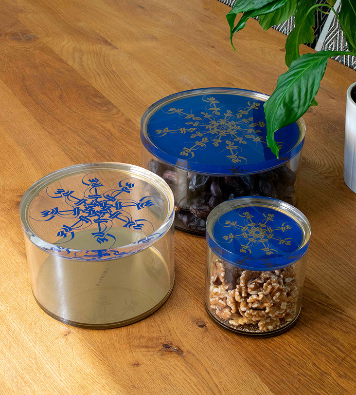 Small Acrylic cylinder container in royal blue and gold with Arabic calligraphy pattern for storing sweets