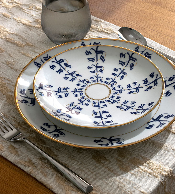 Elegant porcelain salad or dessert plate with Arabic calligraphy pattern in royal blue and gold