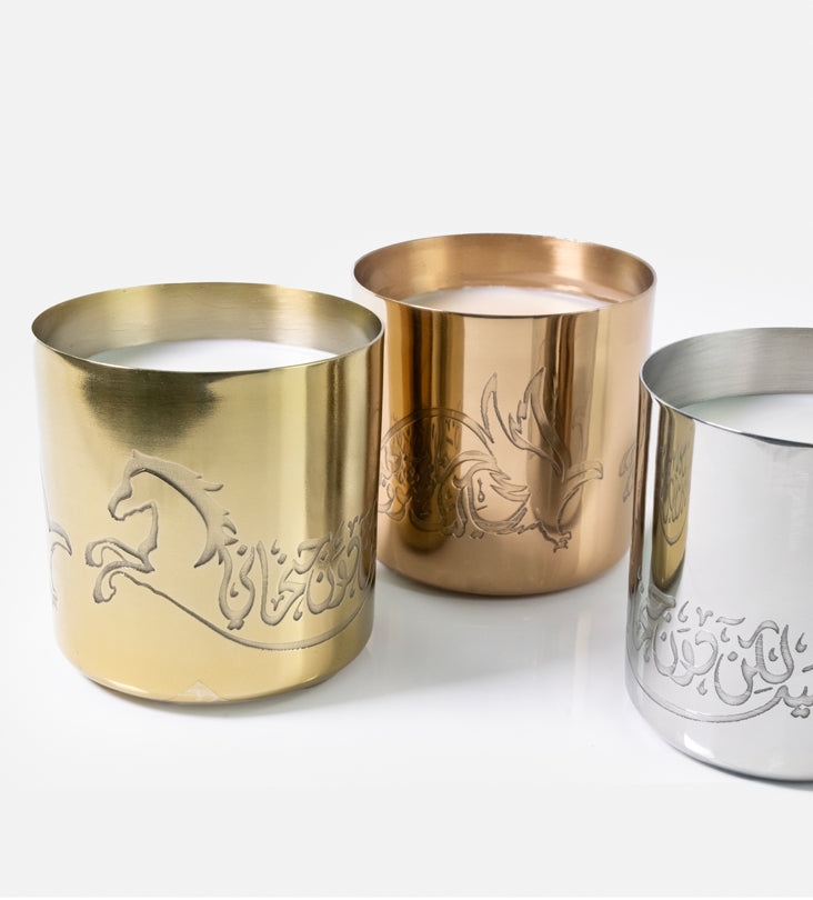 Hand-poured scented candles with fragrances that relate to the UAE in three beautiful metal canisters with Arabic calligraphy etchings featuring a poem by Sheikh Mohamad Bin Rashed Al Maktoum.