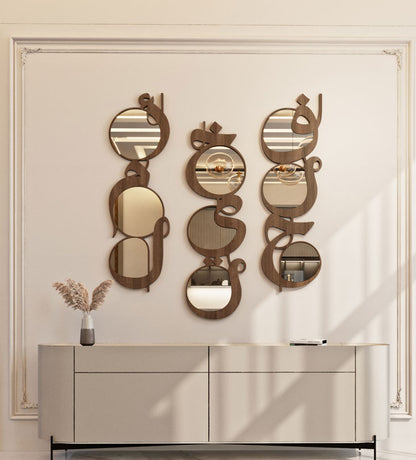 Modern contemporary wooden mirrors in Arabic calligraphy that reads khayr, meaning goodness