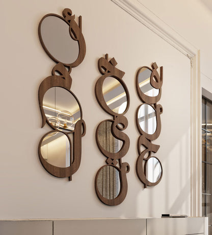 Modern contemporary wooden mirrors in Arabic calligraphy that reads khayr, meaning goodness