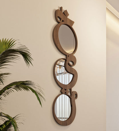 Modern contemporary wooden mirrors in Arabic calligraphy that reads khayr, meaning goodness