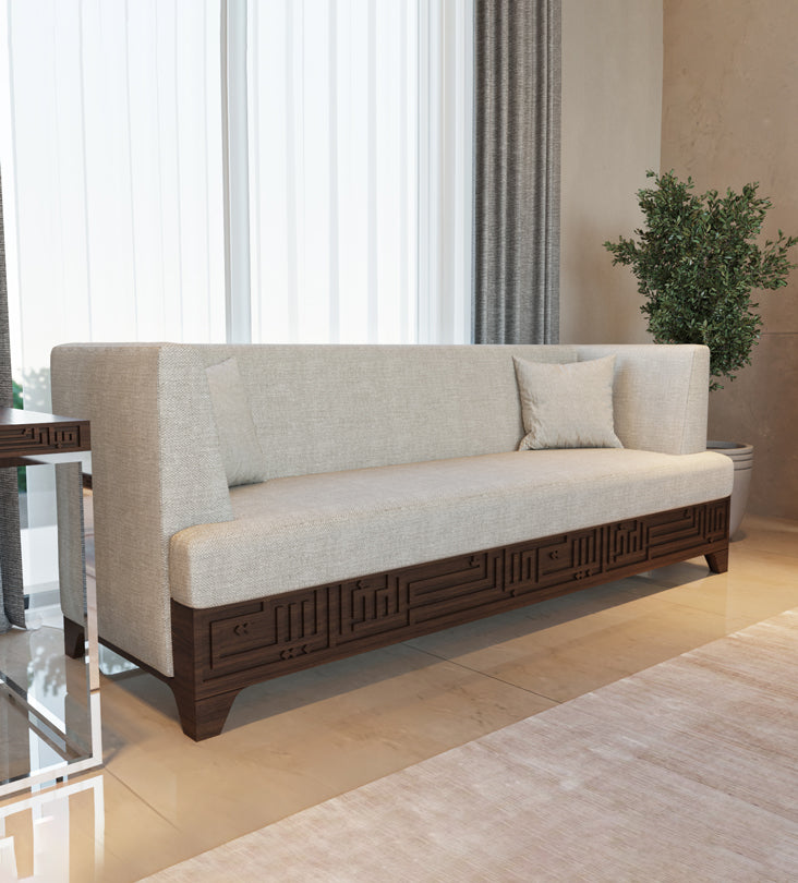 Beige upholstered 4-seater sofa featuring Arabic calligraphy carved woodwork from Kashida design