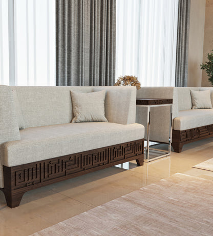 Wood and steel side table featuring kufic arabic calligraphy engraved on the edges of the table