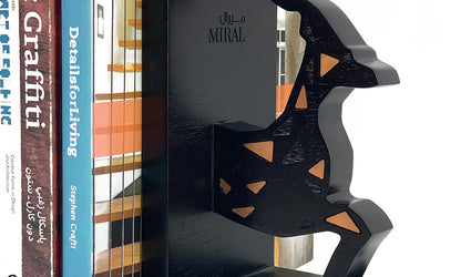 A set of two wooden bookends shaped like a gazelle with copper inlay for Miral corporation in Abu Dhabi, UAE