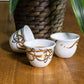 Contemporary gold and silver porcelain coffee cup finjal with Arabic graffiti print