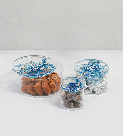 Contemporary transparent acrylic storage cylinders with Arabic calligraphy fluid art