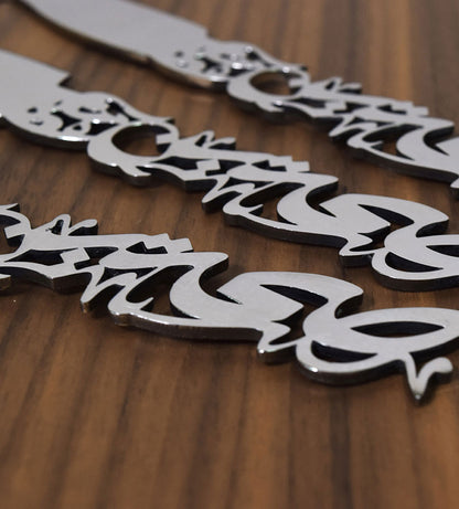 Silver stainless steel cheese cutlery in Arabic calligraphy