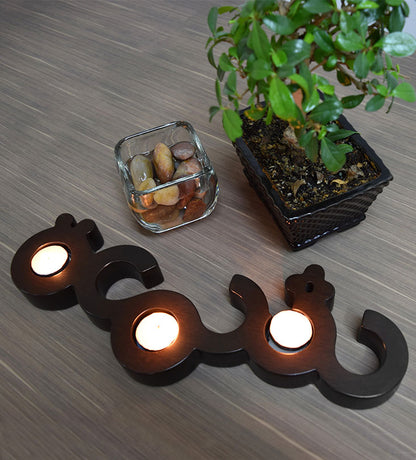 Flat wooden candleholder for tea light candles featuring the word candle in Arabic calligraphy