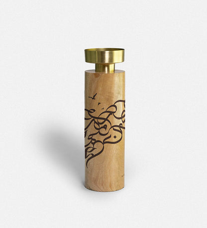 Wooden cylinder candle holders with brass top featuring Arabic graffiti etchings