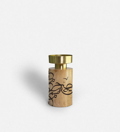 Wooden cylinder candle holders with brass top featuring Arabic graffiti etchings