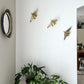 Beautiful brass plated decorative wall hangers shaped like origami birds with modern Arabic calligraphy designed by Kashida