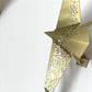 Beautiful brass plated decorative wall hangers shaped like origami birds with modern Arabic calligraphy designed by Kashida