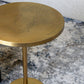 Brass round table with contemporary Arabic graffiti etchingsBrass round table with contemporary Arabic graffiti etchings