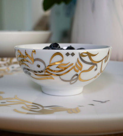 Small gold and silver contemporary serving bowls with Arabic graffiti letters