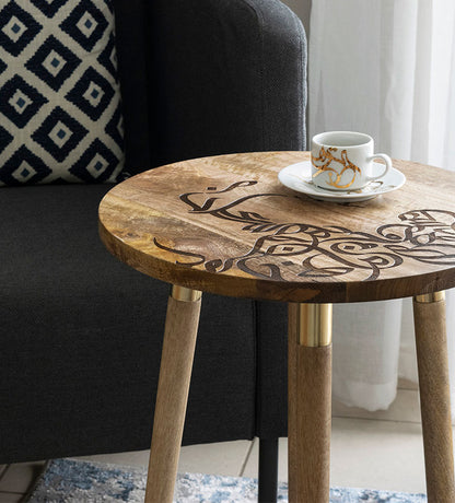 Wooden round table with contemporary Arabic graffiti etchings