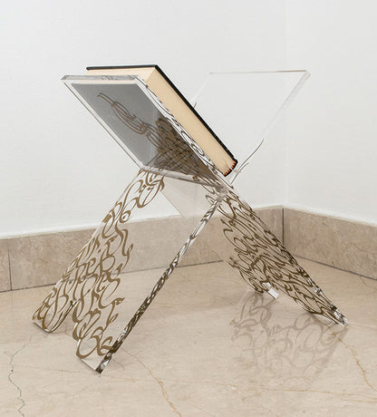 Contemporary transparent quran display stand with Arabic graffiti print