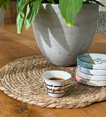 Set of six porcelain Arabic coffee cups by Kashida featuring a verse by Gibran Khalil Gibran in beautiful Arabic calligraphy