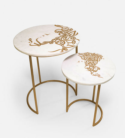 A set of two white marble side tables with contemporary Arabic graffiti etchings and a gold steel base