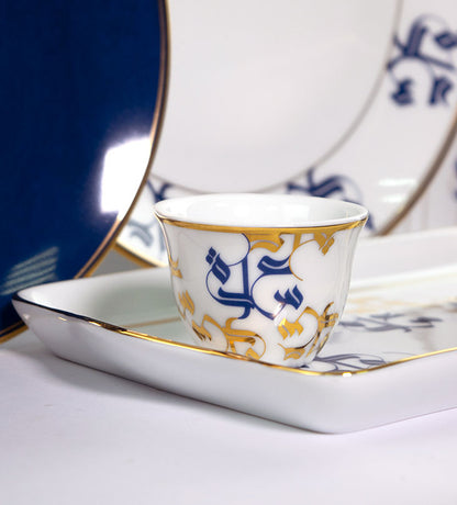 Traditional Arabic coffee cup finjal in royal blue and gold Arabic calligraphy pattern