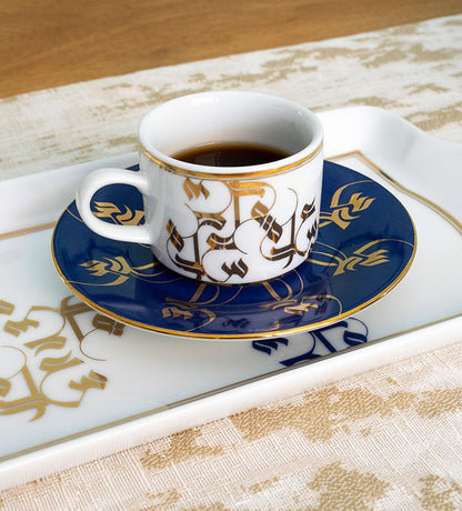 Elegant royal blue and gold espresso cup and saucer with Arabic calligraphy pattern print on porcelain