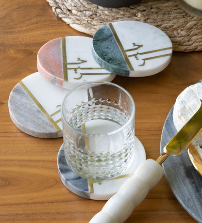 Beautiful pastel colored marble coasters with brass detail in Arabic calligraphy by Kashida